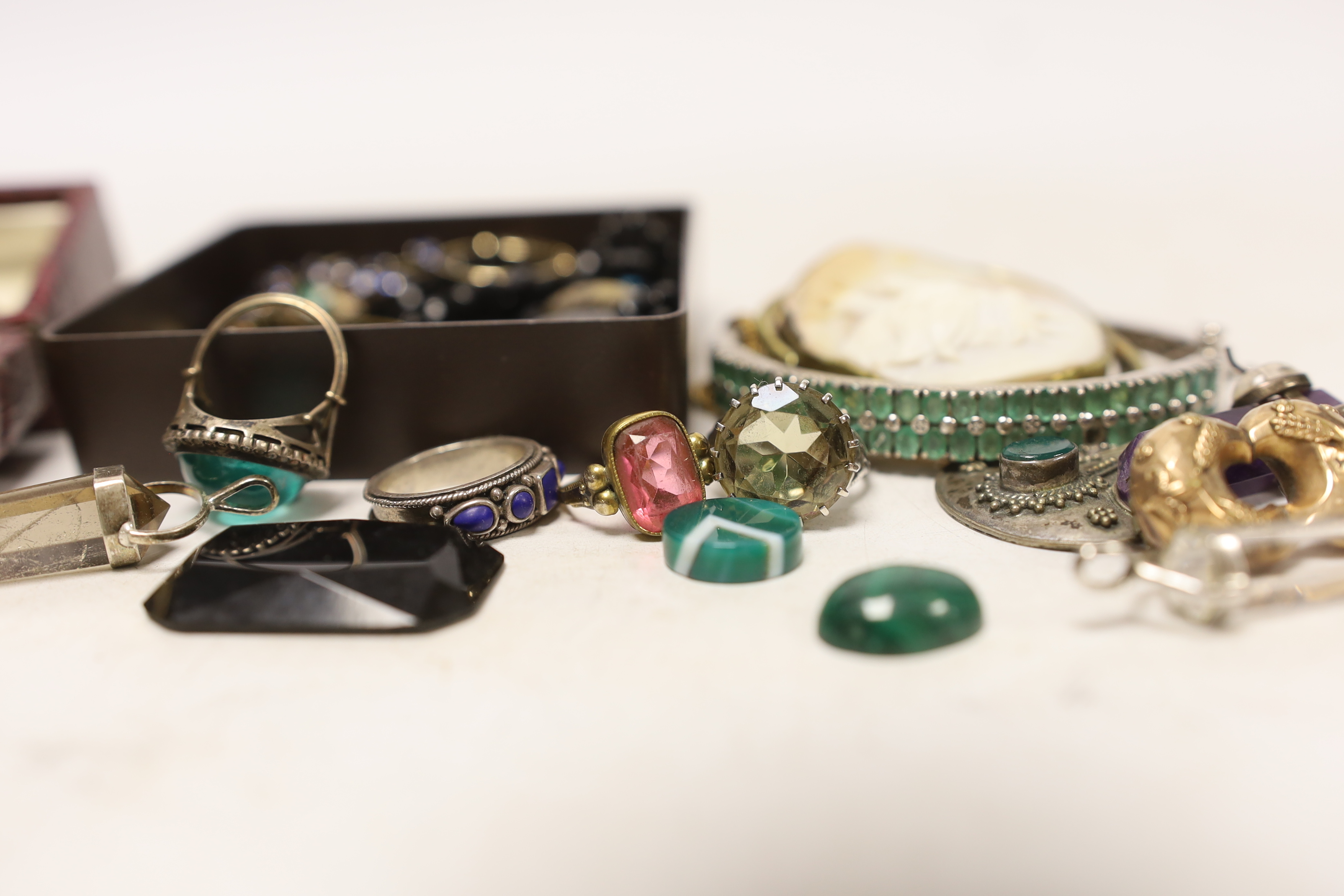A small group of assorted costume jewellery including fob seal, pendants, rings, etc.